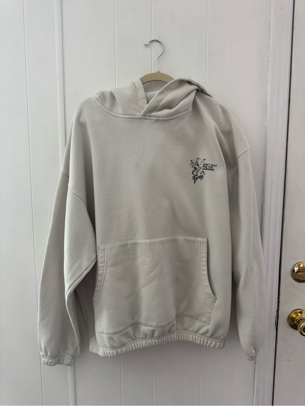 Oversized Cream Pullover Hoodie with Small Chest Graphic